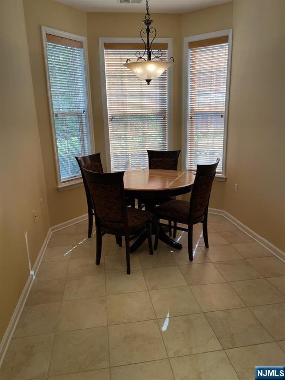 5 Cliff Rd Unit C1, Woodland Park, NJ 07424 - dining space featuring light tile patterned floors and baseboards