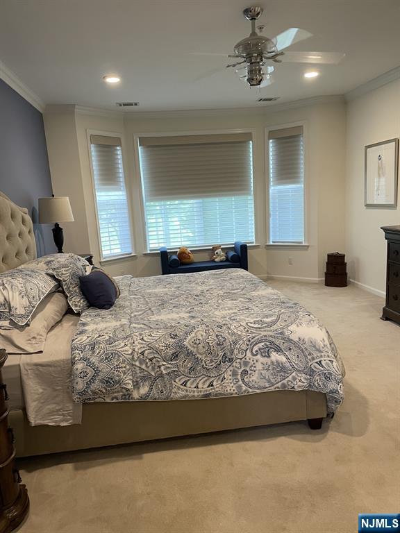 5 Cliff Rd Unit C1, Woodland Park, NJ 07424 - carpeted bedroom with crown molding, a ceiling fan, and recessed lighting
