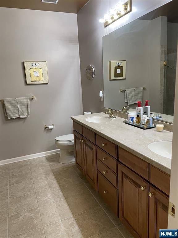 5 Cliff Rd Unit C1, Woodland Park, NJ 07424 - full bathroom with double vanity, tile patterned floors, and a tile shower