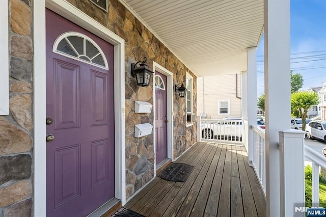187 Wallington Ave, Wallington, NJ 07057 - view of exterior entry with stone siding and a porch