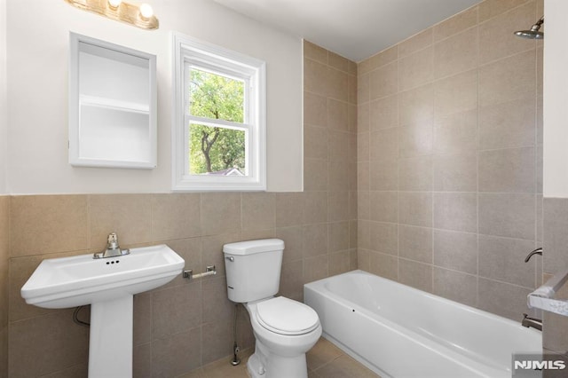 195 Stanley Pl, Hackensack, NJ 07601 - bathroom with tile walls, tile patterned flooring, and wainscoting