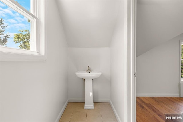 195 Stanley Pl, Hackensack, NJ 07601 - bathroom with plenty of natural light and vaulted ceiling