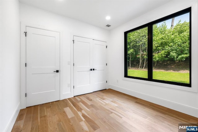 452 Oregon St, Paramus, NJ 07652 - unfurnished bedroom with light wood-type flooring and recessed lighting