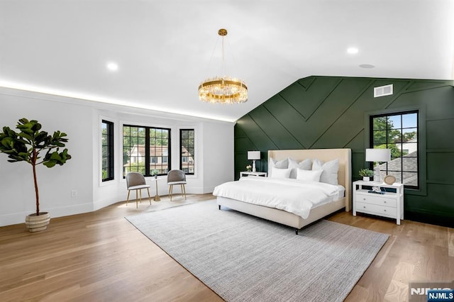452 Oregon St, Paramus, NJ 07652 - bedroom with a chandelier, vaulted ceiling, and wood finished floors