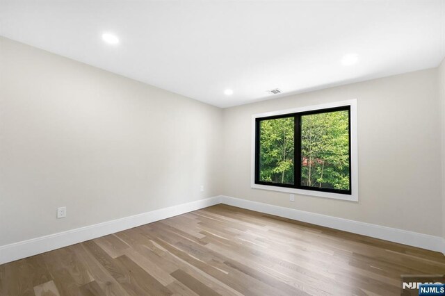 452 Oregon St, Paramus, NJ 07652 - unfurnished room featuring wood finished floors and recessed lighting