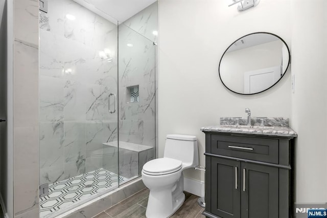 452 Oregon St, Paramus, NJ 07652 - full bath with vanity, a marble finish shower, and wood finished floors