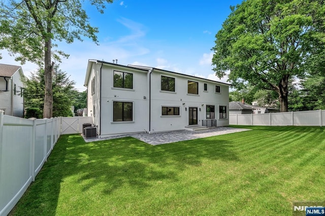 452 Oregon St, Paramus, NJ 07652 - back of house with a patio area, a fenced backyard, and stucco siding