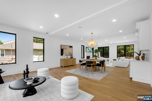 452 Oregon St, Paramus, NJ 07652 - living area with a chandelier, plenty of natural light, light wood finished floors, and recessed lighting