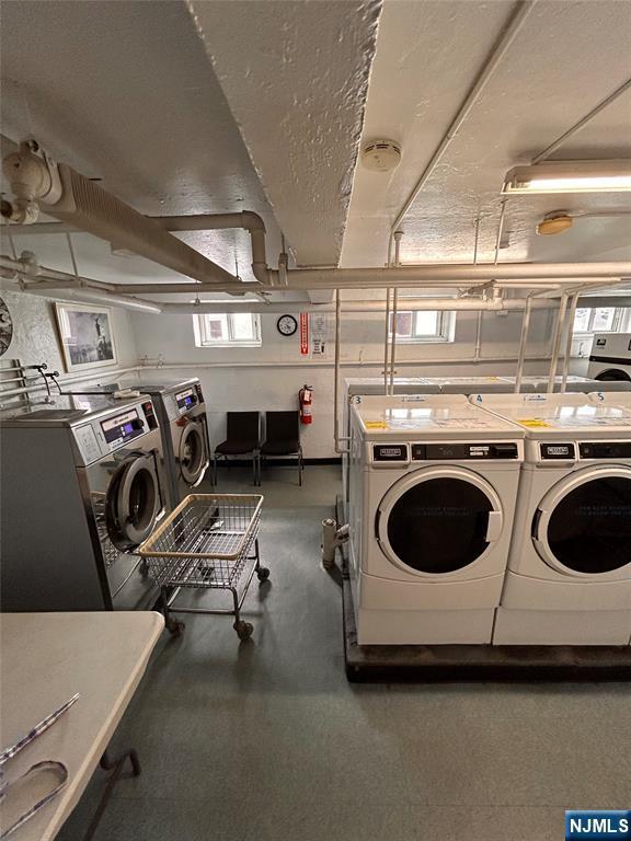 2195 N Central Rd Unit 4H, Fort Lee, NJ 07024 - community laundry featuring washer and clothes dryer