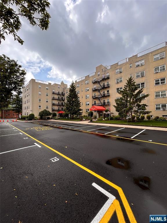 2195 N Central Rd Unit 4H, Fort Lee, NJ 07024 - view of apartment building / complex featuring uncovered parking