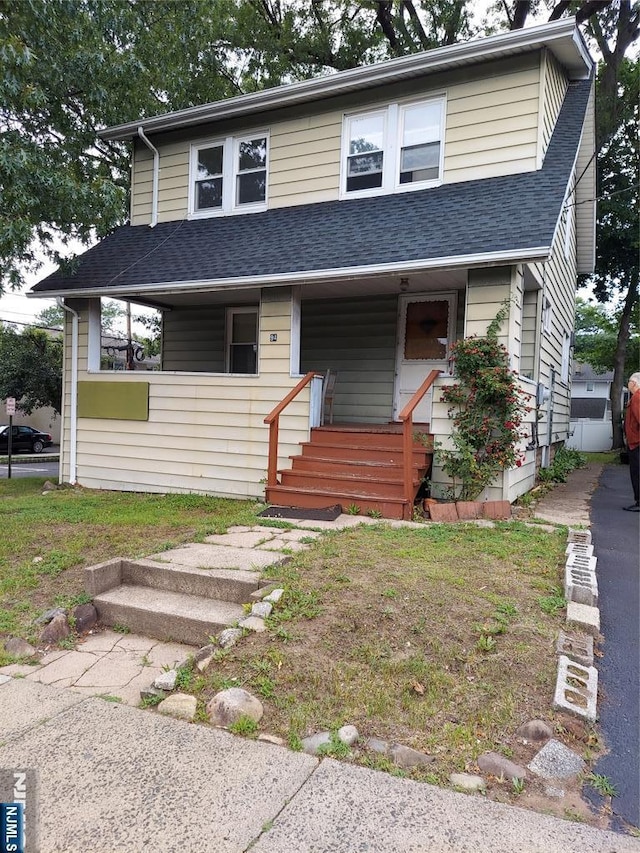 94 Madison Ave, Dumont, NJ 07628 - view of front of property featuring roof with shingles and a porch