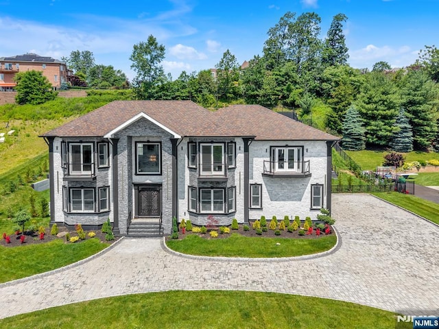 125 Hamilton Trl, Totowa, NJ 07512 - view of front facade with a balcony, curved driveway, and a front lawn