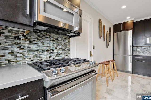 375 Mount Prospect Unit 6B, Newark, NJ 07104 - kitchen featuring stainless steel appliances, decorative backsplash, ornamental molding, dark brown cabinetry, and light marble finish flooring
