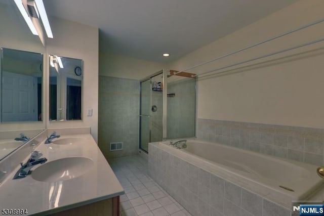 140 Levinberg Ln, Wayne, NJ 07470 - bathroom featuring a garden tub, tile patterned floors, a shower stall, and double vanity
