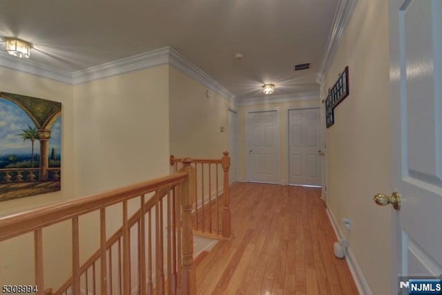 140 Levinberg Ln, Wayne, NJ 07470 - hall with an upstairs landing, light wood-style floors, and crown molding
