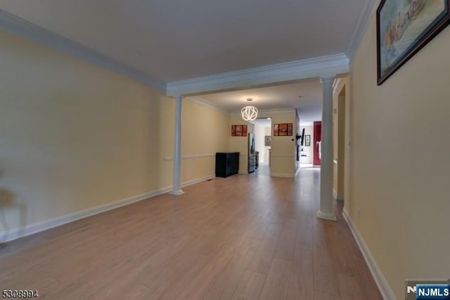 140 Levinberg Ln, Wayne, NJ 07470 - unfurnished living room featuring decorative columns, ornamental molding, and wood finished floors