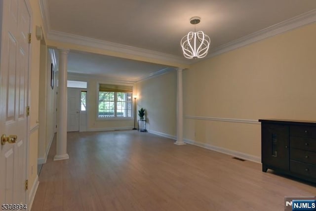 140 Levinberg Ln, Wayne, NJ 07470 - unfurnished room with decorative columns, ornamental molding, light wood-style floors, and a chandelier