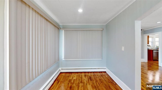 39 Boyden Pkwy, Maplewood, NJ 07040 - unfurnished room with crown molding, wood finished floors, and a baseboard radiator