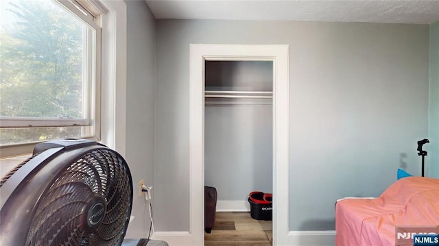 39 Boyden Pkwy, Maplewood, NJ 07040 - bedroom with multiple windows, wood finished floors, and a closet