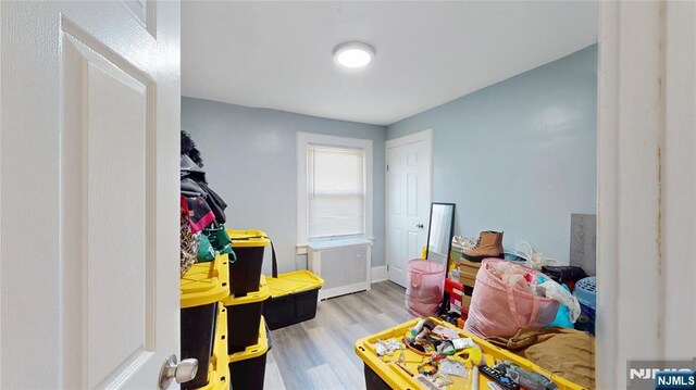 39 Boyden Pkwy, Maplewood, NJ 07040 - recreation room featuring wood finished floors and radiator
