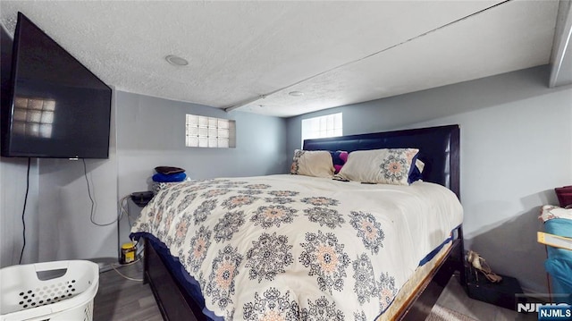 39 Boyden Pkwy, Maplewood, NJ 07040 - bedroom featuring wood finished floors and a textured ceiling
