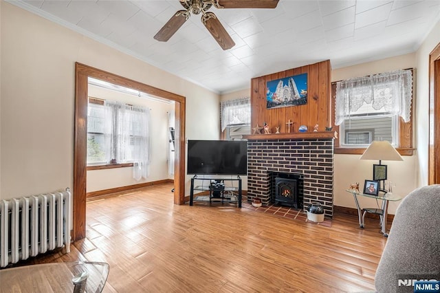 1 Whittlesey Ave, West Orange, NJ 07052 - living area with radiator heating unit, ceiling fan, ornamental molding, and light wood-type flooring