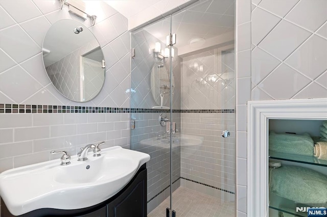 747 Mildred St, Teaneck, NJ 07666 - full bath featuring tile walls, a stall shower, and vanity