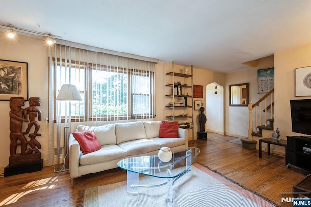 279 Jefferson Ave, Cresskill, NJ 07626 - living area with wood finished floors, arched walkways, and stairs
