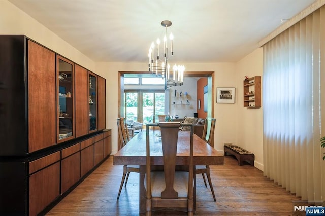 279 Jefferson Ave, Cresskill, NJ 07626 - dining space with light wood-style flooring and a chandelier