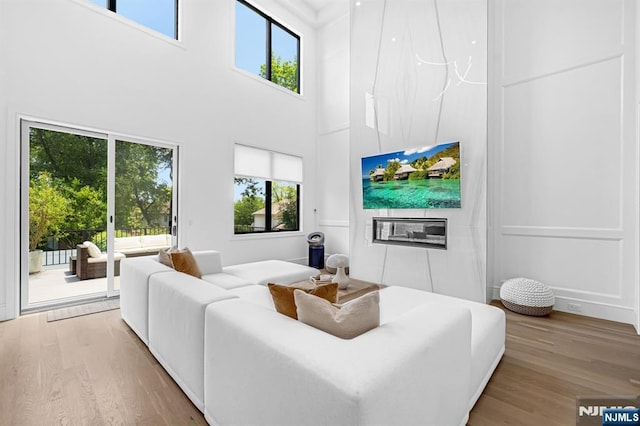 404 Willard Rd, Paramus, NJ 07652 - living room featuring light wood-style flooring and a towering ceiling