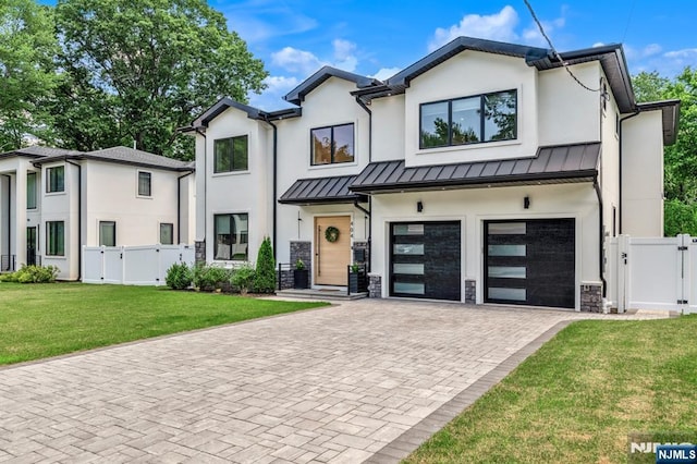 404 Willard Rd, Paramus, NJ 07652 - view of front of house with a gate, an attached garage, decorative driveway, and a standing seam roof