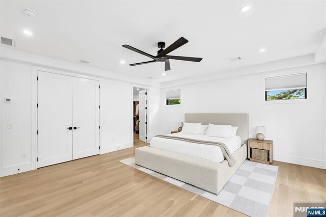 404 Willard Rd, Paramus, NJ 07652 - bedroom featuring light wood-style floors, multiple windows, recessed lighting, and ceiling fan