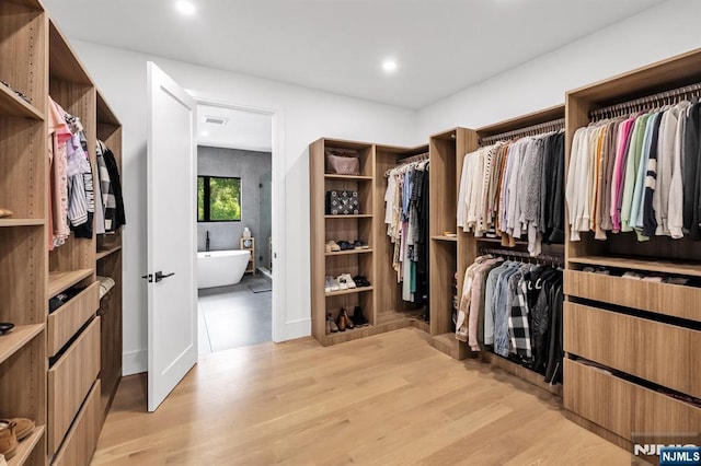 404 Willard Rd, Paramus, NJ 07652 - walk in closet with light wood-style floors