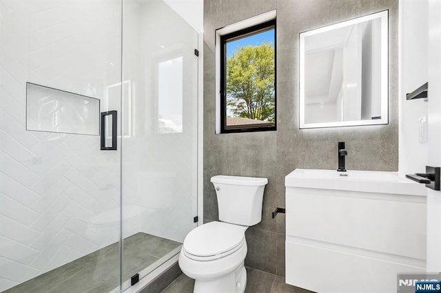 404 Willard Rd, Paramus, NJ 07652 - full bathroom featuring vanity, a stall shower, and tile patterned flooring
