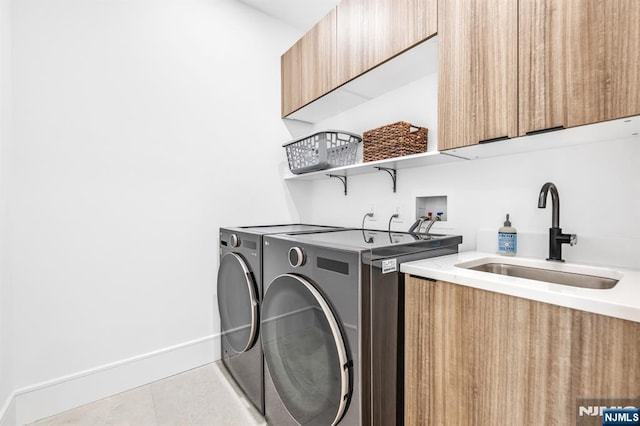 404 Willard Rd, Paramus, NJ 07652 - laundry room featuring cabinet space, washing machine and clothes dryer, and light tile patterned floors