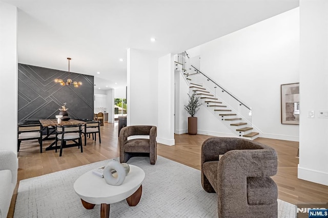 404 Willard Rd, Paramus, NJ 07652 - living room with stairs, a chandelier, recessed lighting, and wood finished floors
