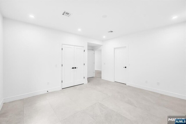 404 Willard Rd, Paramus, NJ 07652 - unfurnished bedroom with recessed lighting and light tile patterned flooring