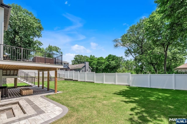 404 Willard Rd, Paramus, NJ 07652 - fenced backyard with stairway, a patio area, and a wooden deck