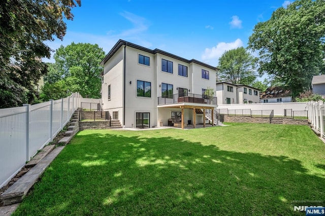 404 Willard Rd, Paramus, NJ 07652 - rear view of house with stairs, stucco siding, a wooden deck, a fenced backyard, and a patio