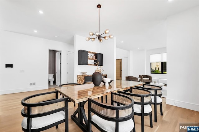 404 Willard Rd, Paramus, NJ 07652 - dining area featuring a chandelier, light wood-style flooring, and recessed lighting