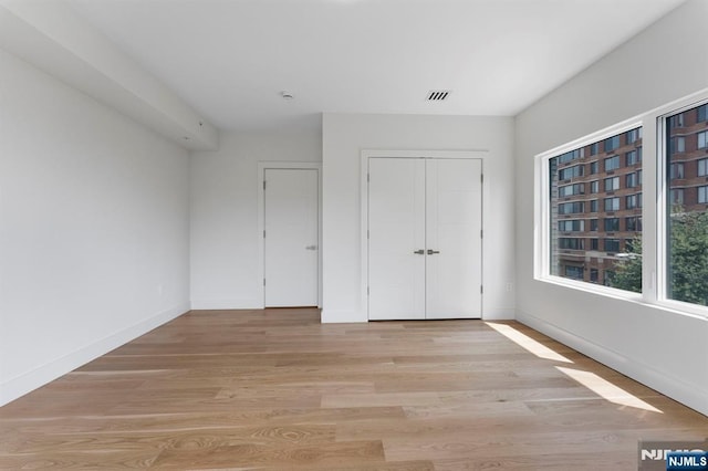 135 Old Palisade Rd Unit B, Fort Lee, NJ 07024 - unfurnished bedroom with light wood-style flooring and a closet
