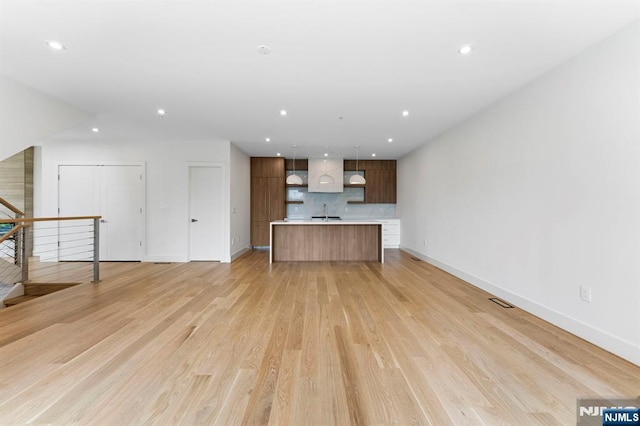 135 Old Palisade Rd Unit B, Fort Lee, NJ 07024 - unfurnished living room with recessed lighting and light wood-style floors