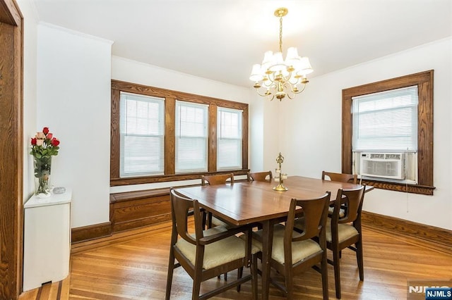 39 Lexington Ave, Bloomfield, NJ 07003 - dining room featuring a chandelier, light wood-style flooring, cooling unit, and crown molding