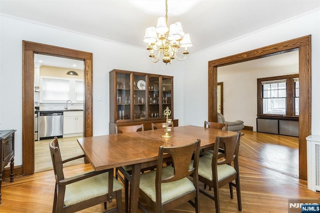 39 Lexington Ave, Bloomfield, NJ 07003 - dining area featuring a chandelier and light wood finished floors