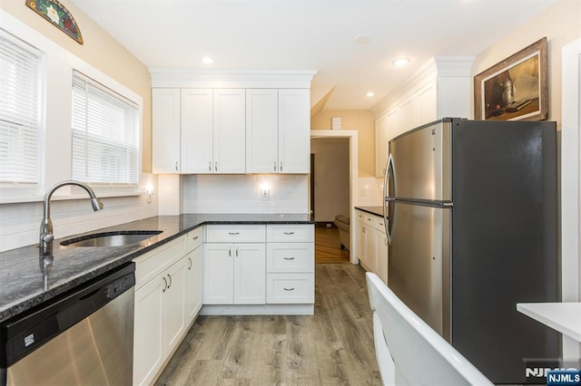 39 Lexington Ave, Bloomfield, NJ 07003 - kitchen featuring appliances with stainless steel finishes, light wood-style flooring, white cabinetry, and recessed lighting