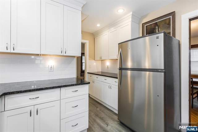 39 Lexington Ave, Bloomfield, NJ 07003 - kitchen with freestanding refrigerator, wood finished floors, white cabinets, backsplash, and recessed lighting