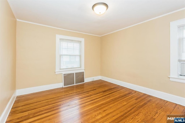 39 Lexington Ave, Bloomfield, NJ 07003 - empty room with wood-type flooring and crown molding