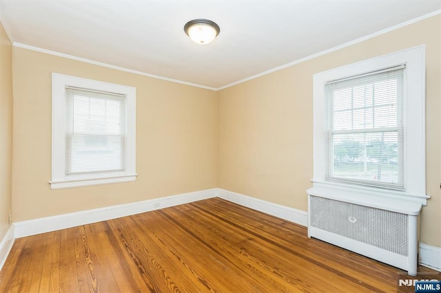 39 Lexington Ave, Bloomfield, NJ 07003 - spare room featuring radiator, crown molding, and wood finished floors