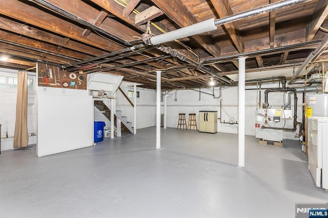 39 Lexington Ave, Bloomfield, NJ 07003 - unfinished basement with stairs, a heating unit, and water heater