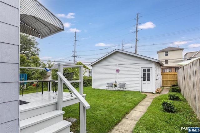 39 Lexington Ave, Bloomfield, NJ 07003 - fenced backyard with a deck and an outdoor structure